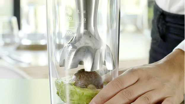 Immersion blender mixes avocado with seed