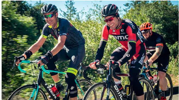 Biking men on a road bike