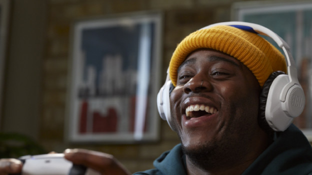 Happy person with a gaming headset on his head