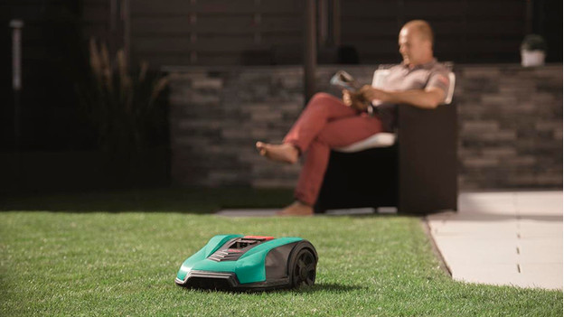 Robot lawn mower in garden