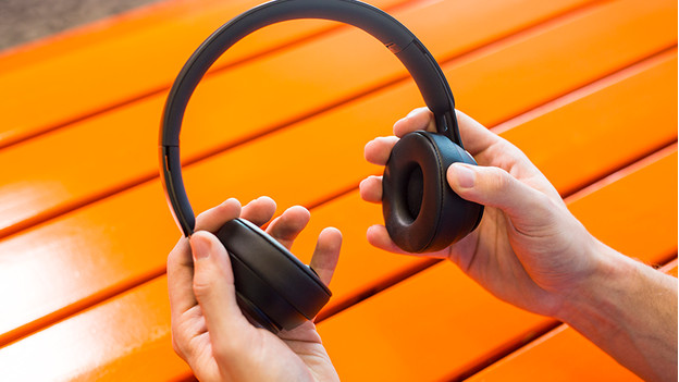 Headphones in hand