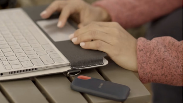 SanDisk SSD next to a laptop