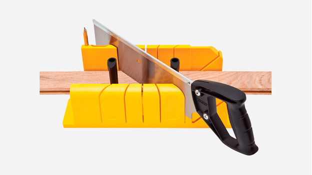 Sawing baseboards in miter with a miter box