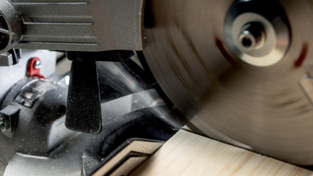 Close-up of a saw blade on a radial arm saw