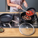 KitchenAid Forged Hardened Aluminum High-sided Skillet with Lid 28cm product in use