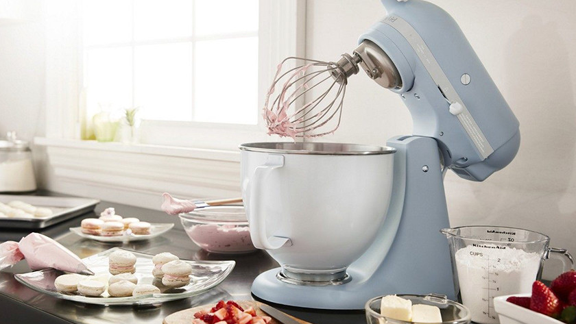 Light blue KitchenAid stand mixer with macarons