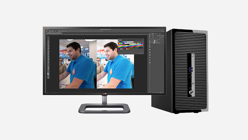 Computer with monitor and Photoshop on the screen.