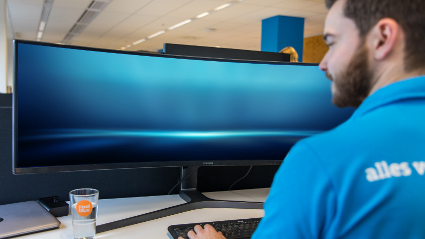 Expert working with a Samsung ultrawide monitor