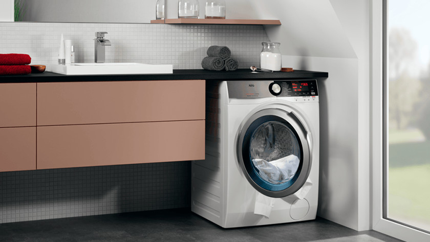 Washer dryer combination in bathroom