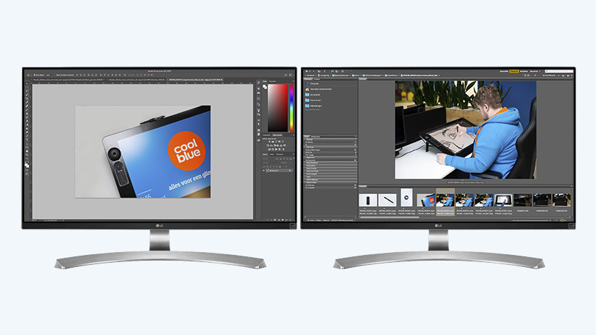 2 graphic monitors next to each other, with both Adobe Photoshop and InDesign
