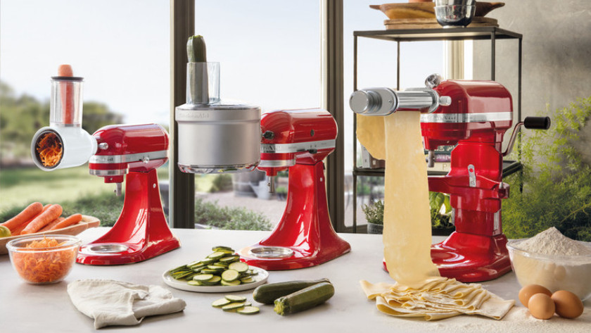 KitchenAid stand mixers with grater, slicer, and pasta roller attachment.
