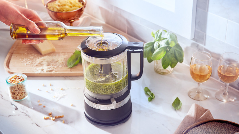 Homemade pesto in a matte black KitchenAid food chopper