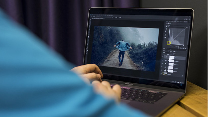 Man works on 16-inch laptop.