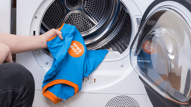 Washer dryer combination with open drum door.