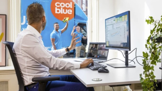 Home office with a monitor next to a laptop