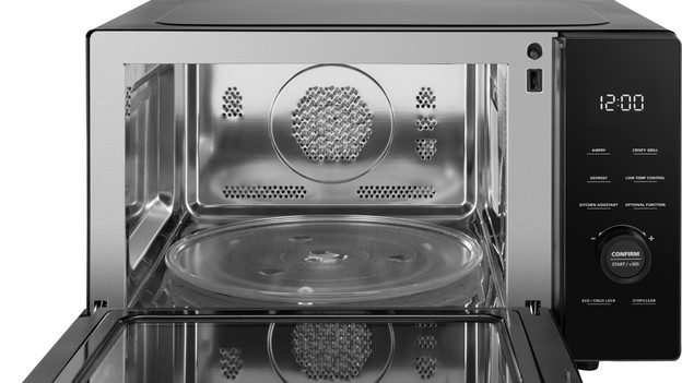 The interior of a Wisberg combi microwave with a glass plate