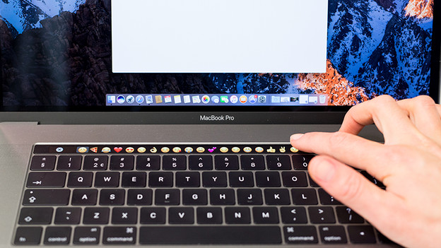 Emoticons on the Touch Bar of a MacBook.