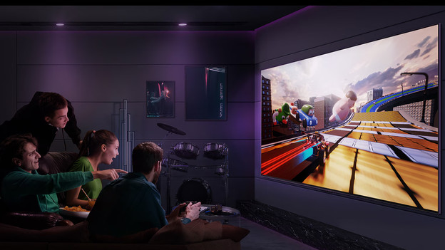 Friends gaming on an LG OLED TV.