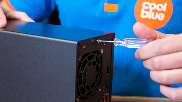 Man opens NAS with a screwdriver