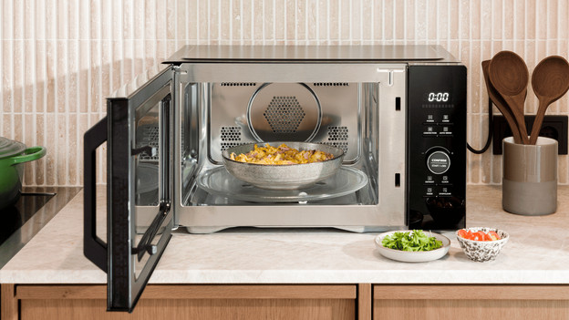 A plate with food inside a Wisberg combi microwave