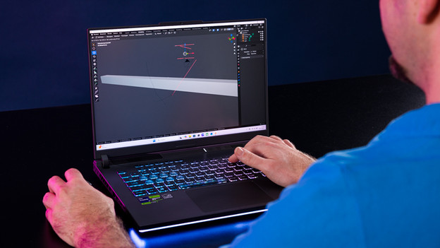 Expert working in Blender on ASUS ROG Strix gaming laptop