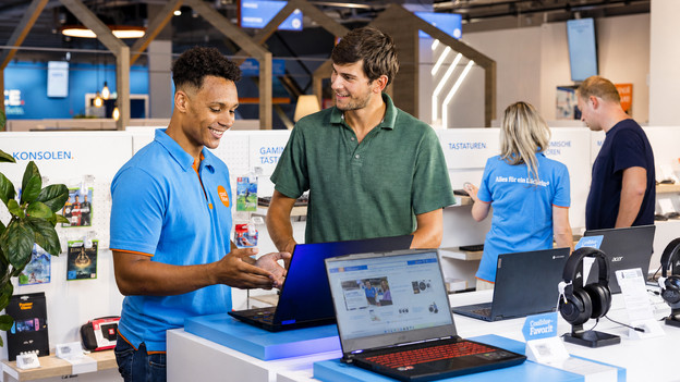A customer looks at laptops in a Coolblue store.