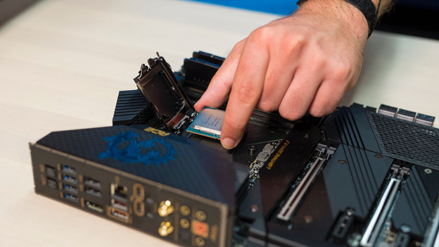 Expert removes the old processor from the motherboard