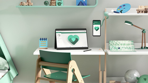 Laptop und Handy mit Microsoft 365.