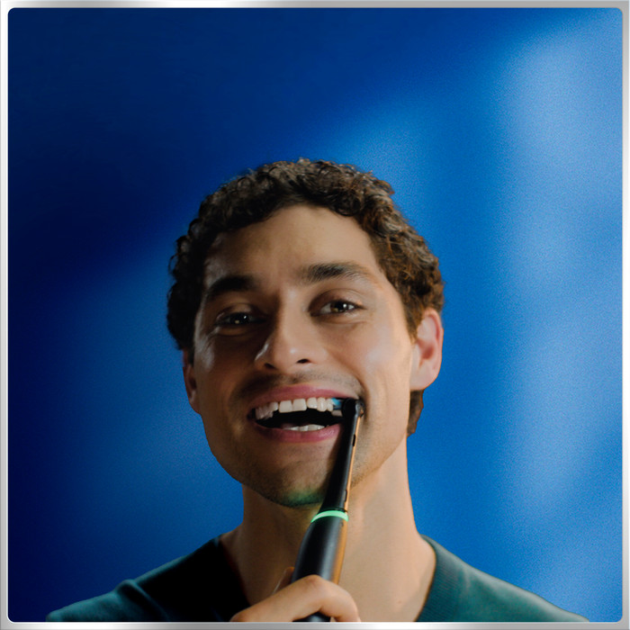 Oral-B iO 6 Black Holiday Edition with 4 brush heads product in use