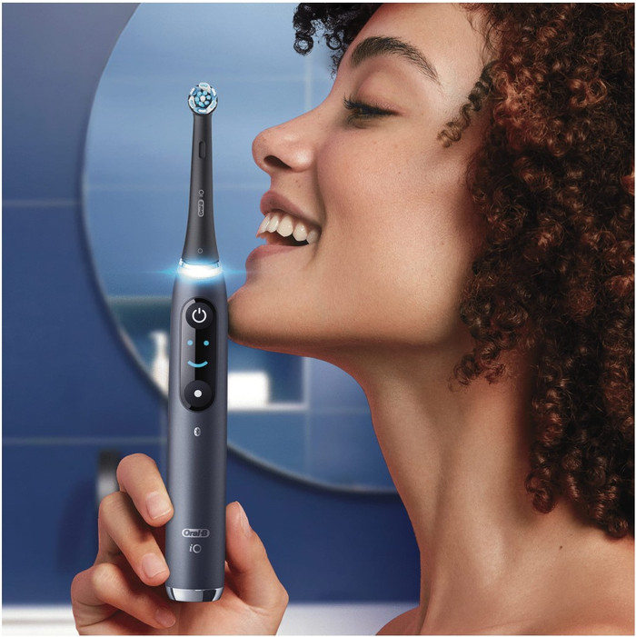 Oral-B iO 9 Holiday Edition with Extra Brush Attachments product in use