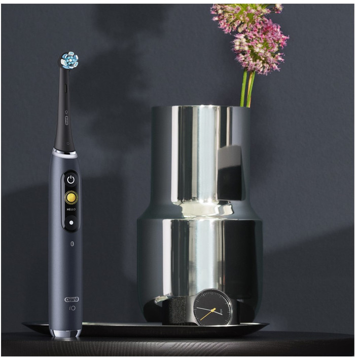 Oral-B iO 9 Holiday Edition with Extra Brush Attachments product in use