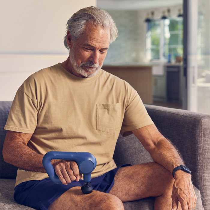 Theragun Relief Navy product in use