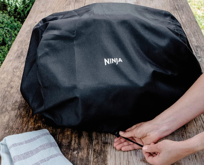 Ninja Woodfire Outdoor Grill OG701EU Starter Pack product in use