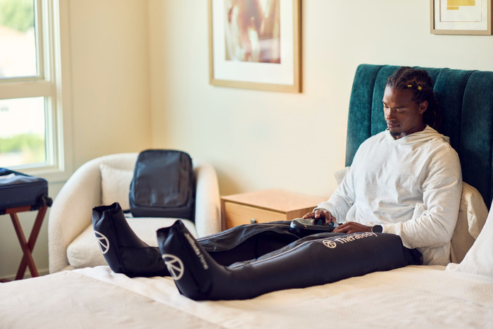 Therabody JetBoots Prime Medium product in use