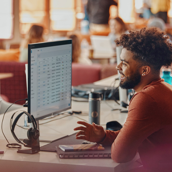 Poly Voyager Focus 2 MS Wireless Office Headset + Charging Dock product in use