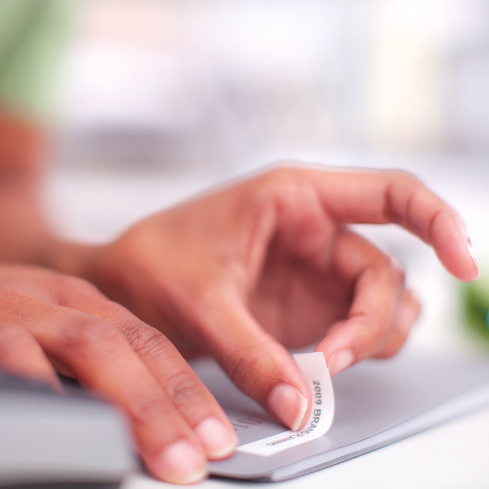 DYMO D1 12mm x 7m 10 Tapes Black White Labels product in use