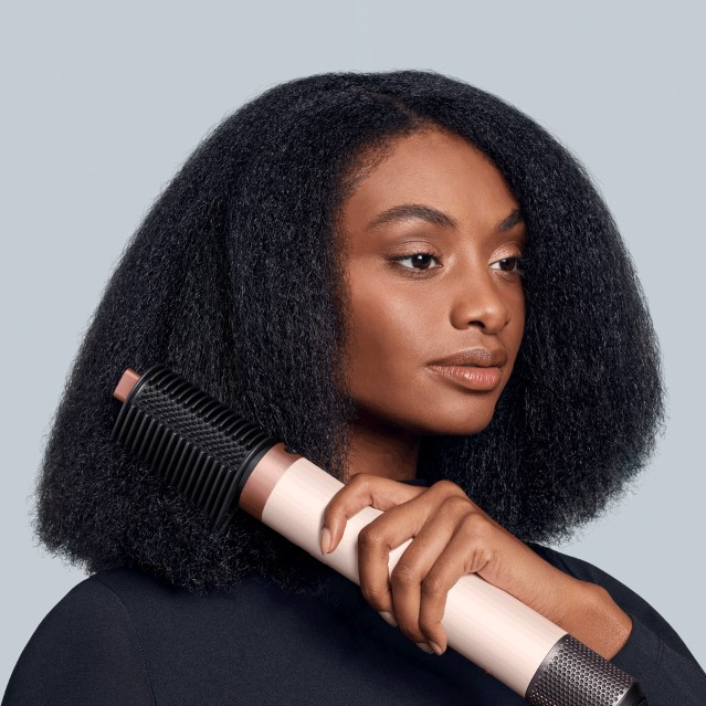 Dyson Airwrap Co-anda 2x Curly + Coily Ceramic Pink product in use