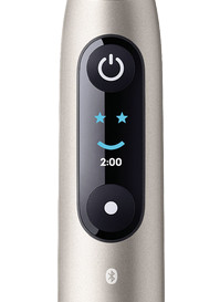 Oral-B iO 9 Gold with white brush head detail