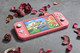 Nintendo Switch Lite Korallrot + Bigben Offizielle Nintendo Switch Lite Schutztasche visueller lieferant