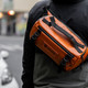 WANDRD Rogue Sling 6L Orange product in use